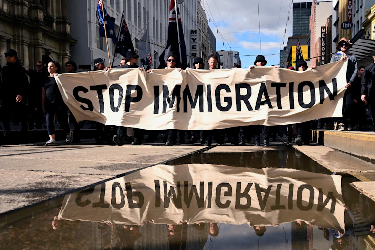 Protestors march down Bourke Street during an anti-immigration rally in Melbourne, on August 31, 2025.