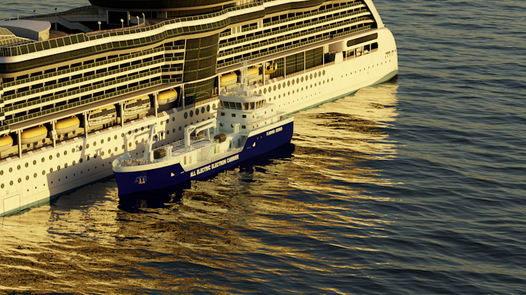 a battery powered ship next to a larger vessel.
