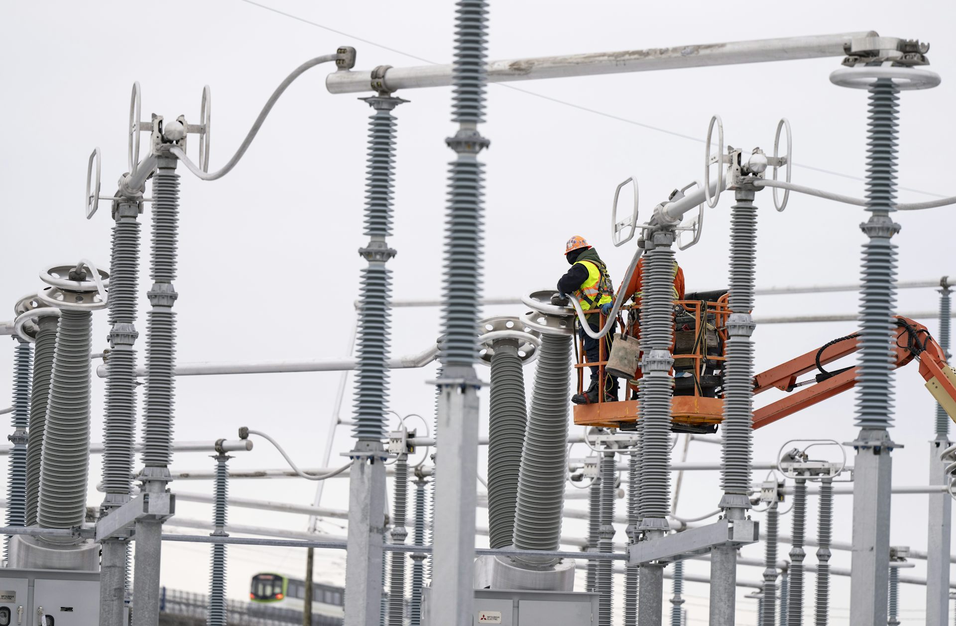 Workers working on an electrical structure