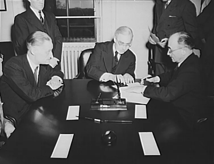 Jean Monnet (right) at the signing of the lend-lease agreement in 1941.