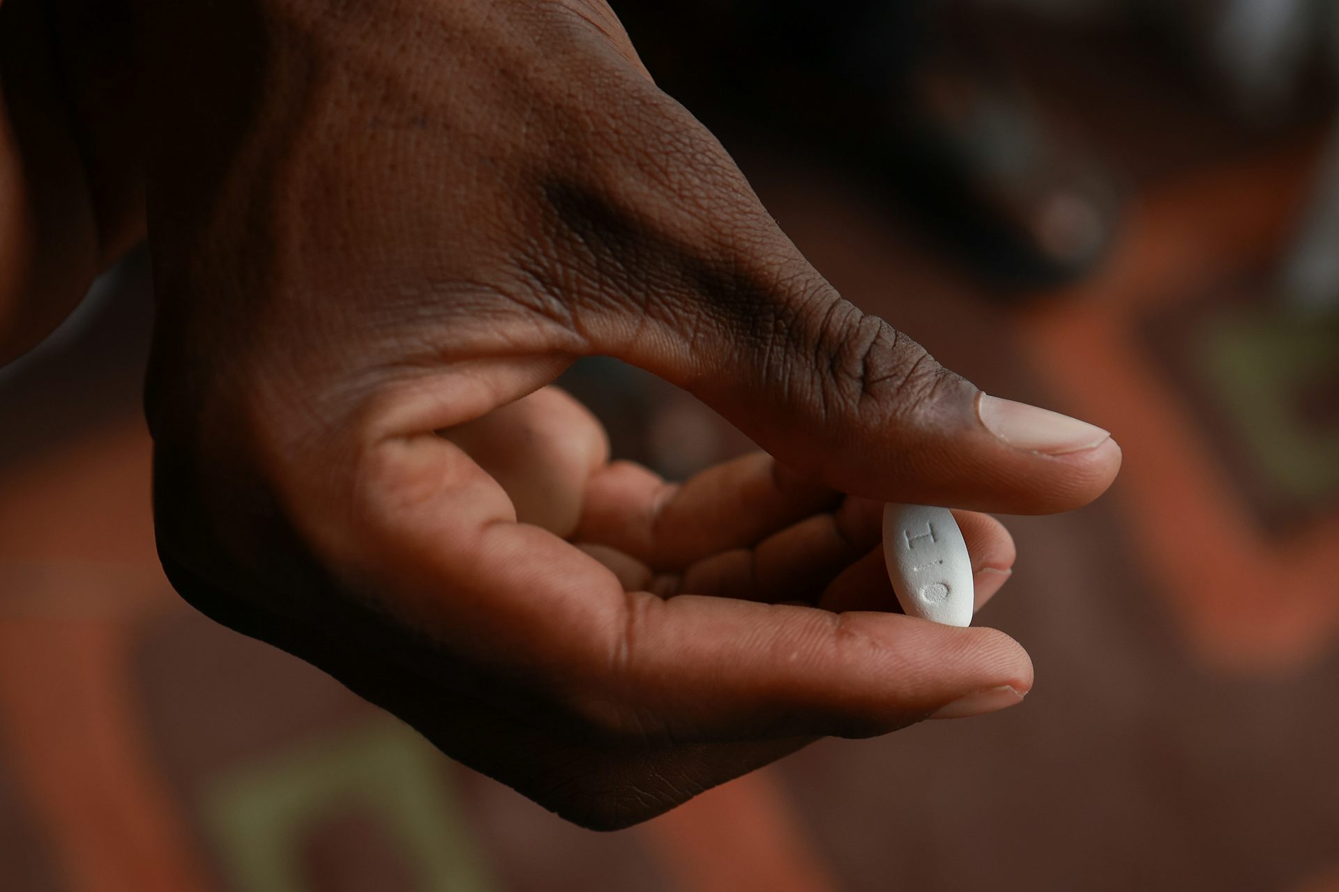  patient holds a medication used for the treatment of HIV infection in adults 