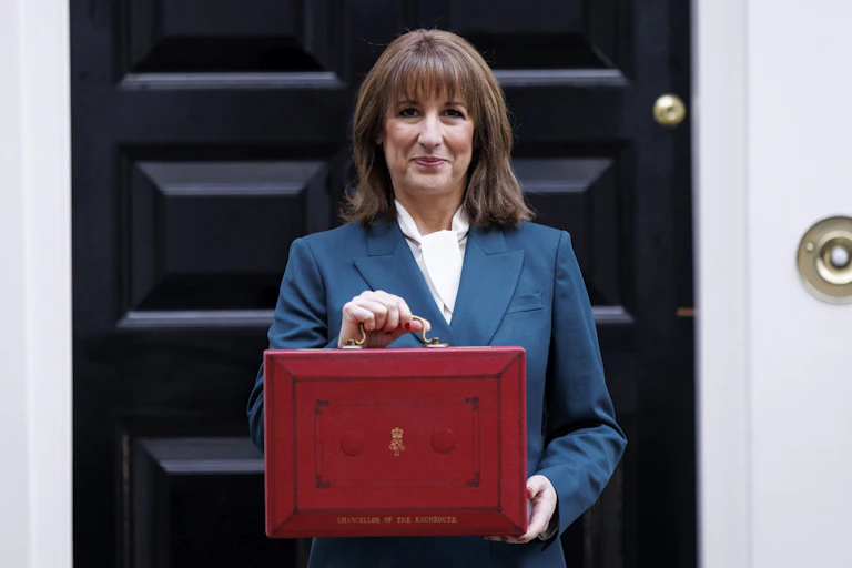 Rachel Reeves in front of number 11, posing with her red briefcase