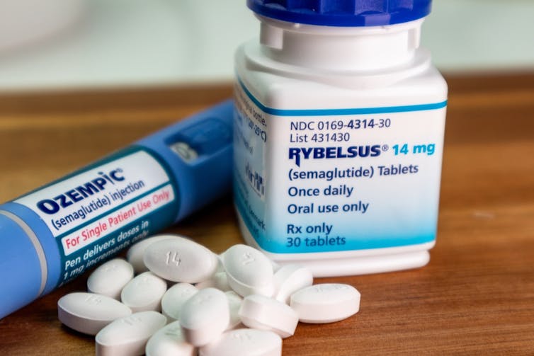 A bottle containing Rybelsus pills, with an Ozempic injector pen on the side.
