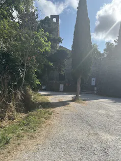 A path leading towards a large stone building.