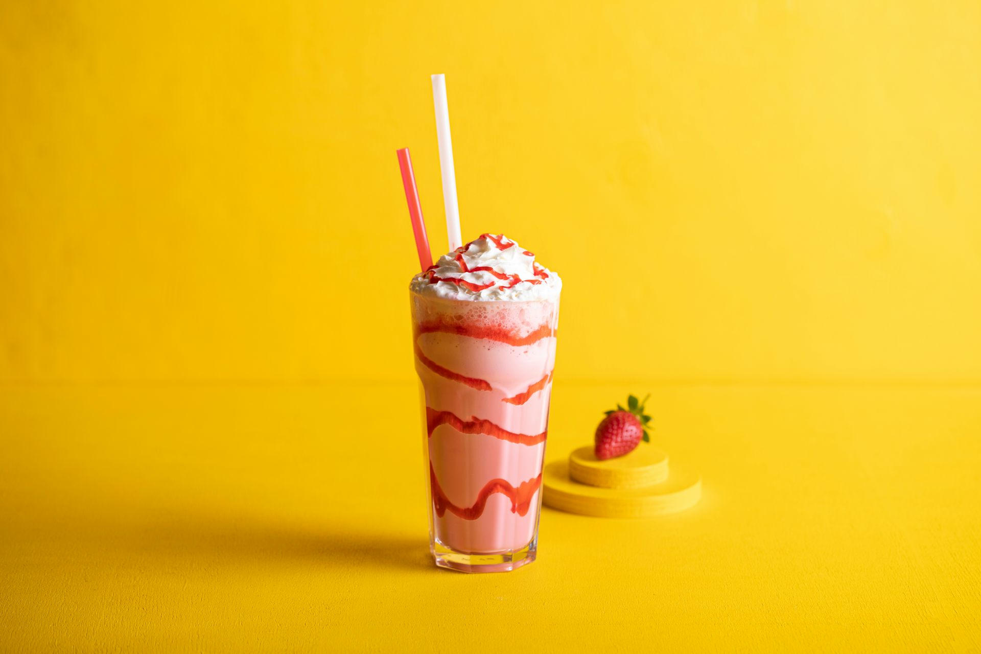 Pink milkshake in a glass.