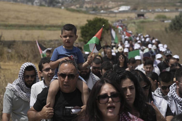 People marching together in commemoration of Nakba Day.