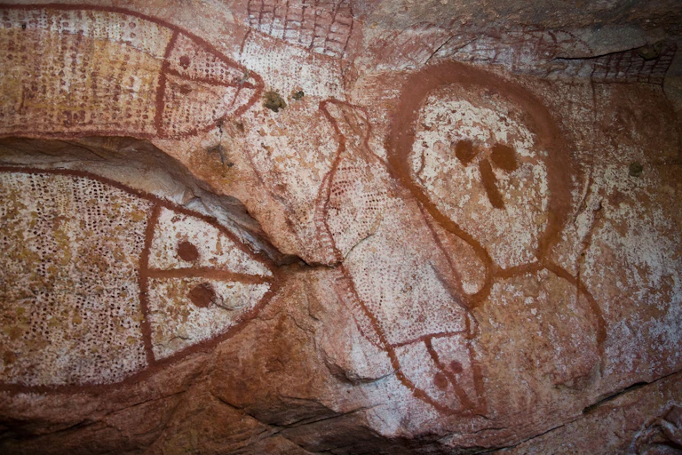 An Aboriginal cave painting depicting the Wandjina creative spirit with fish.