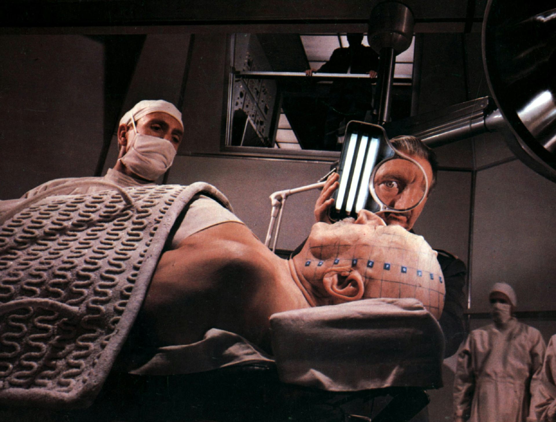 Scene from the film Fantastic Voyage where the patients head is being prepped. 