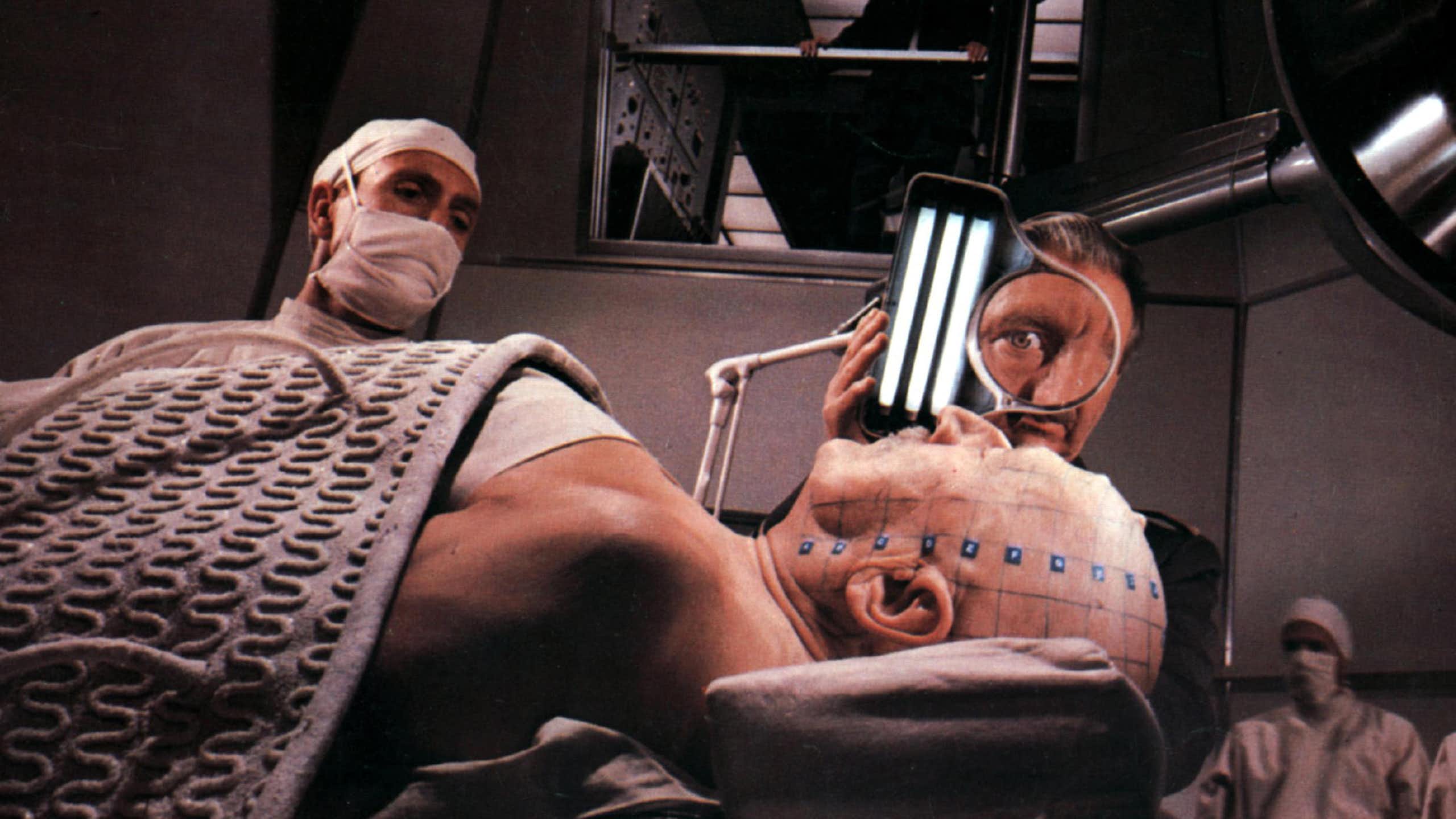 Scene from the film Fantastic Voyage where the patients head is being prepped.