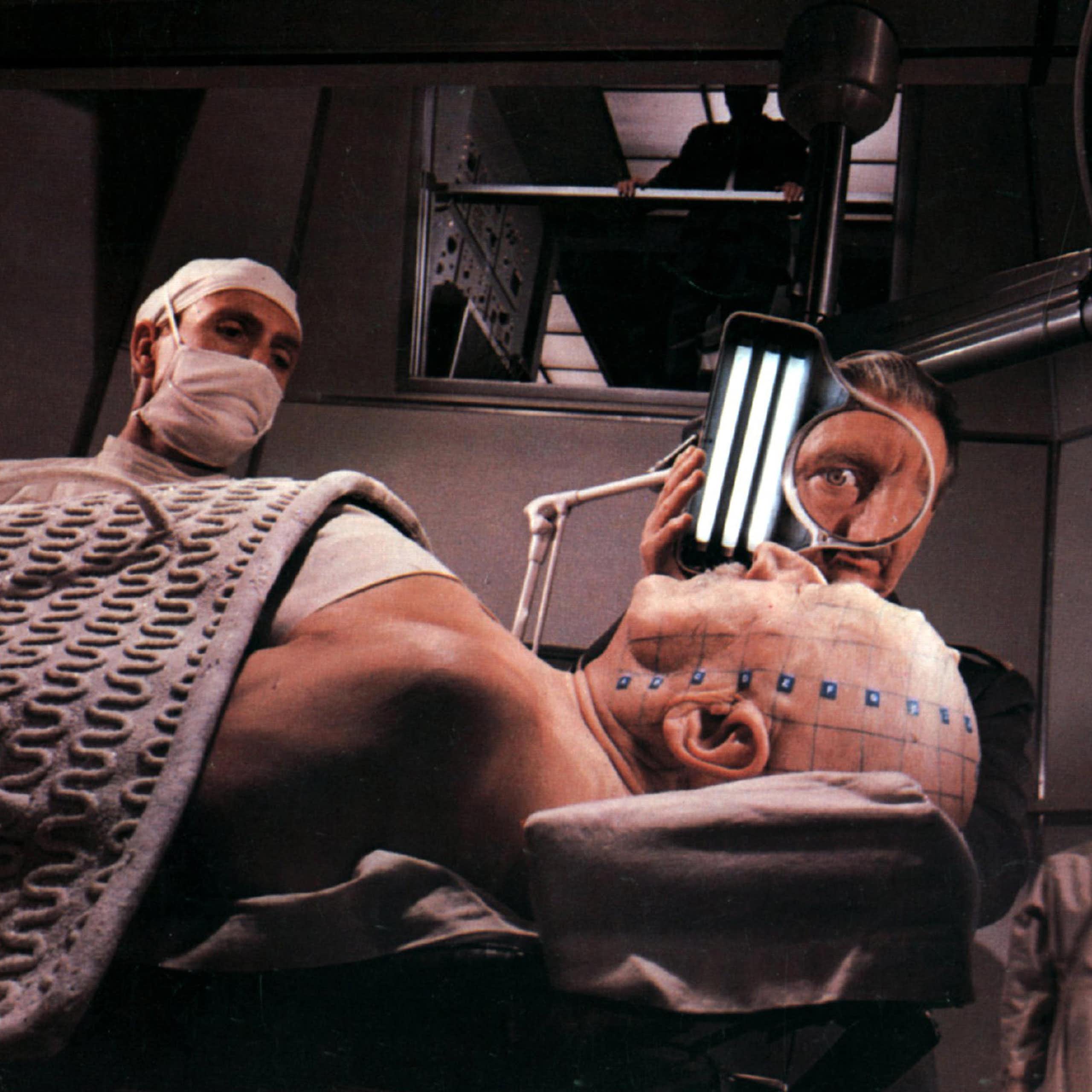 Scene from the film Fantastic Voyage where the patients head is being prepped.
