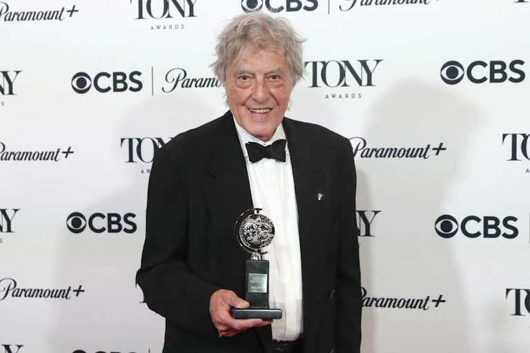 Stoppard holds a Tony Award in 2023.