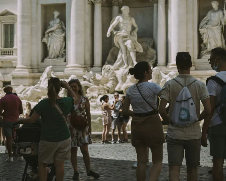 Tourists at the Trevi Fountain.