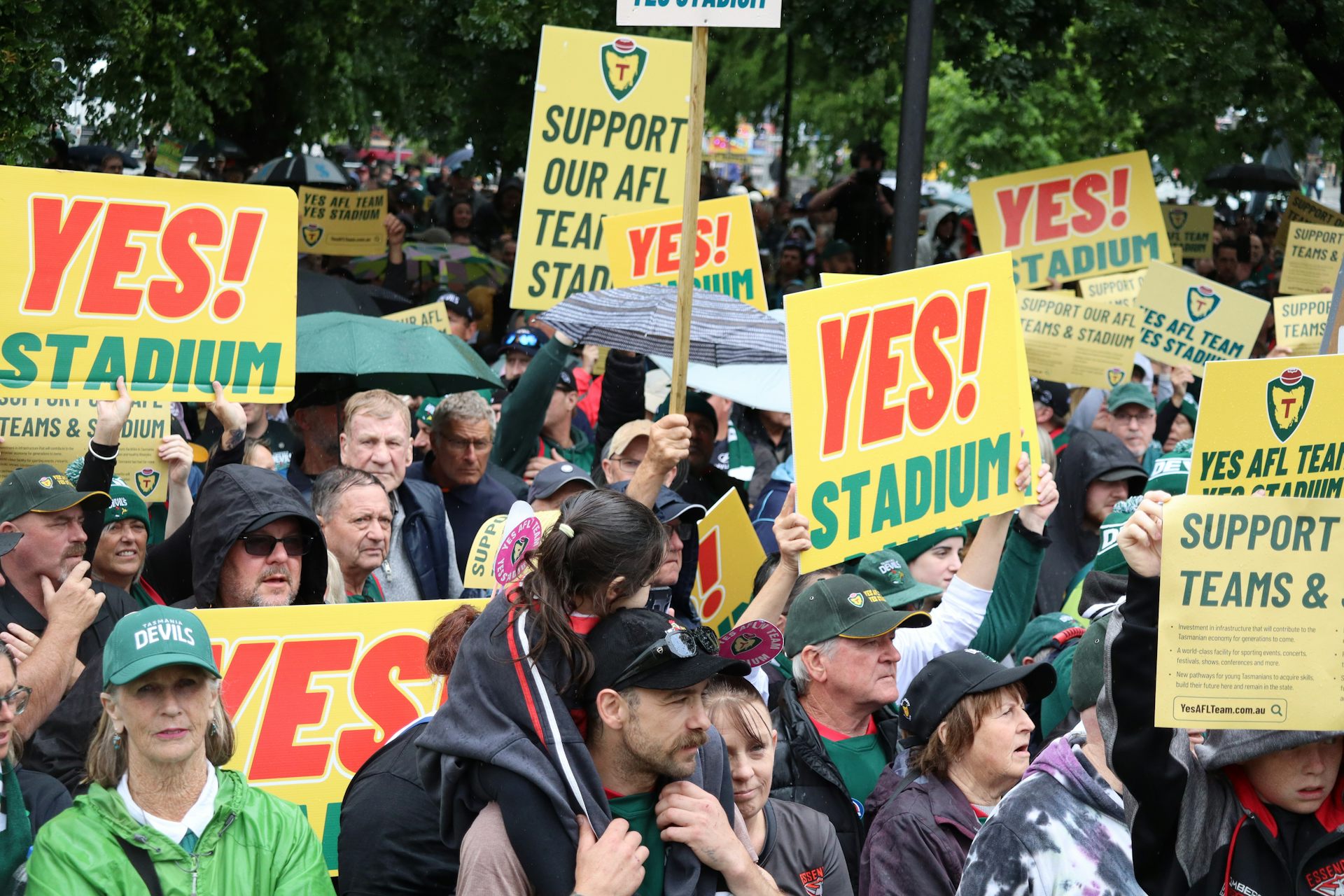 Tasmanians supporting the new AFL stadium cheer on during a rally in Hobart.