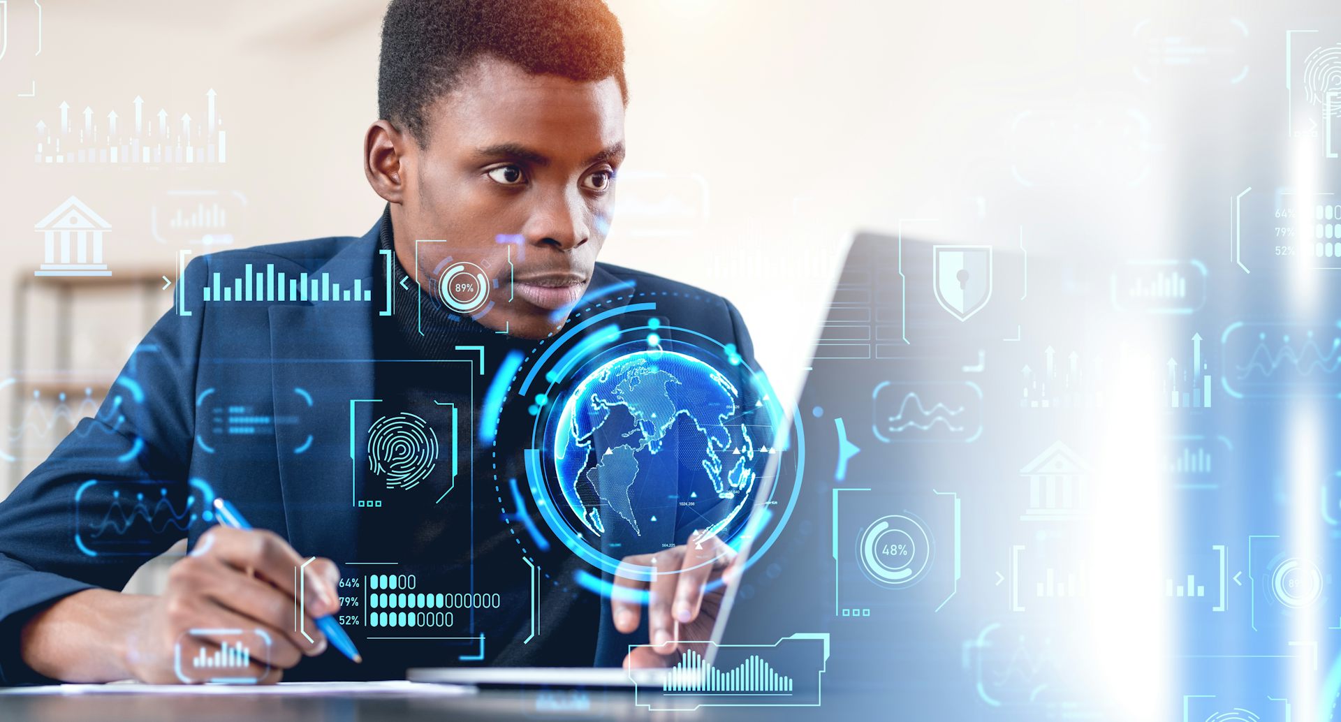 A man sits at a laptop while digital globes and graphs flash in the air around him, depicting his interaction with the digital economy