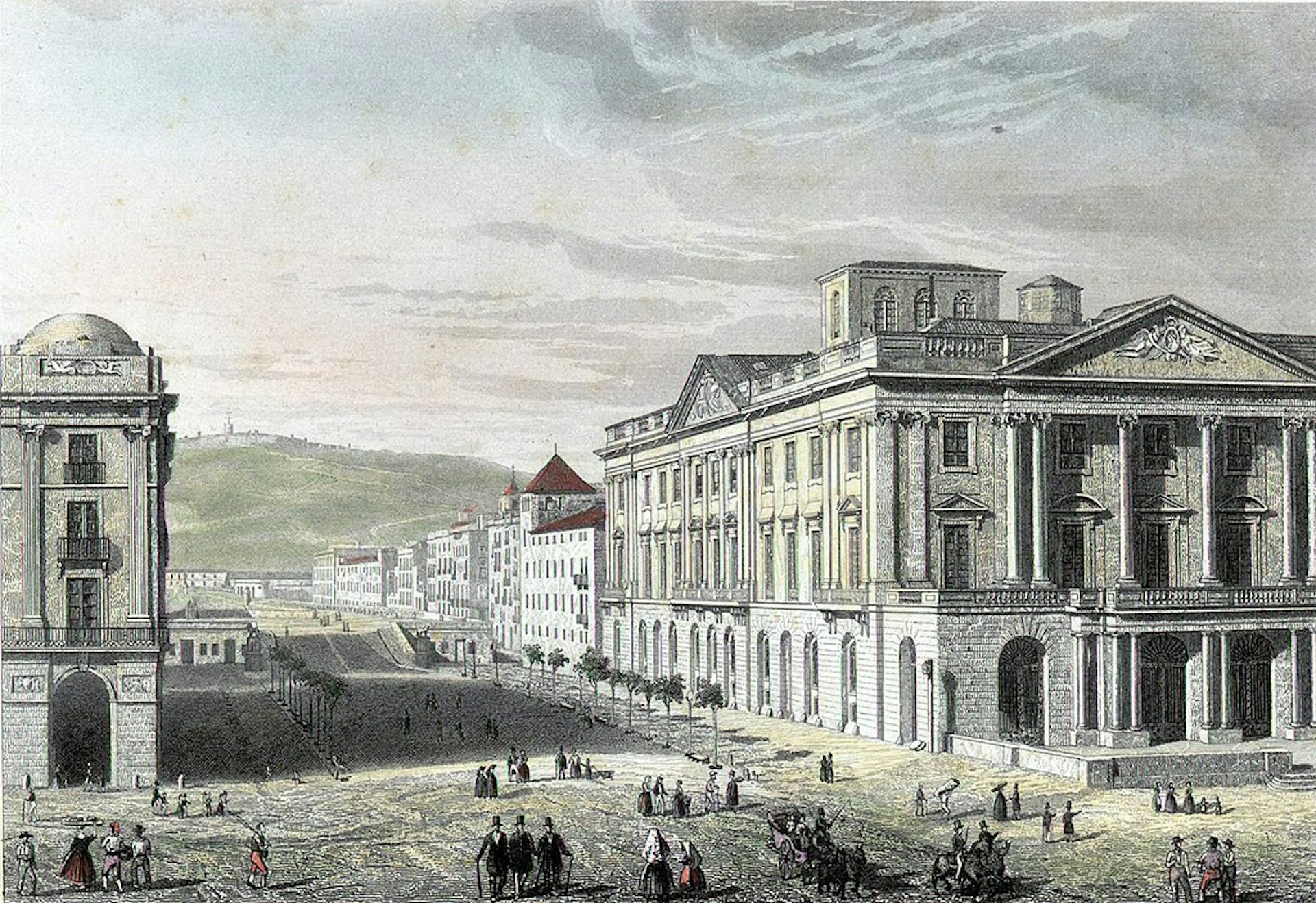 View of the main and side facades of the Lotja building. People walk through Isabel II promenade. On the left, the porticoes of Xifra.