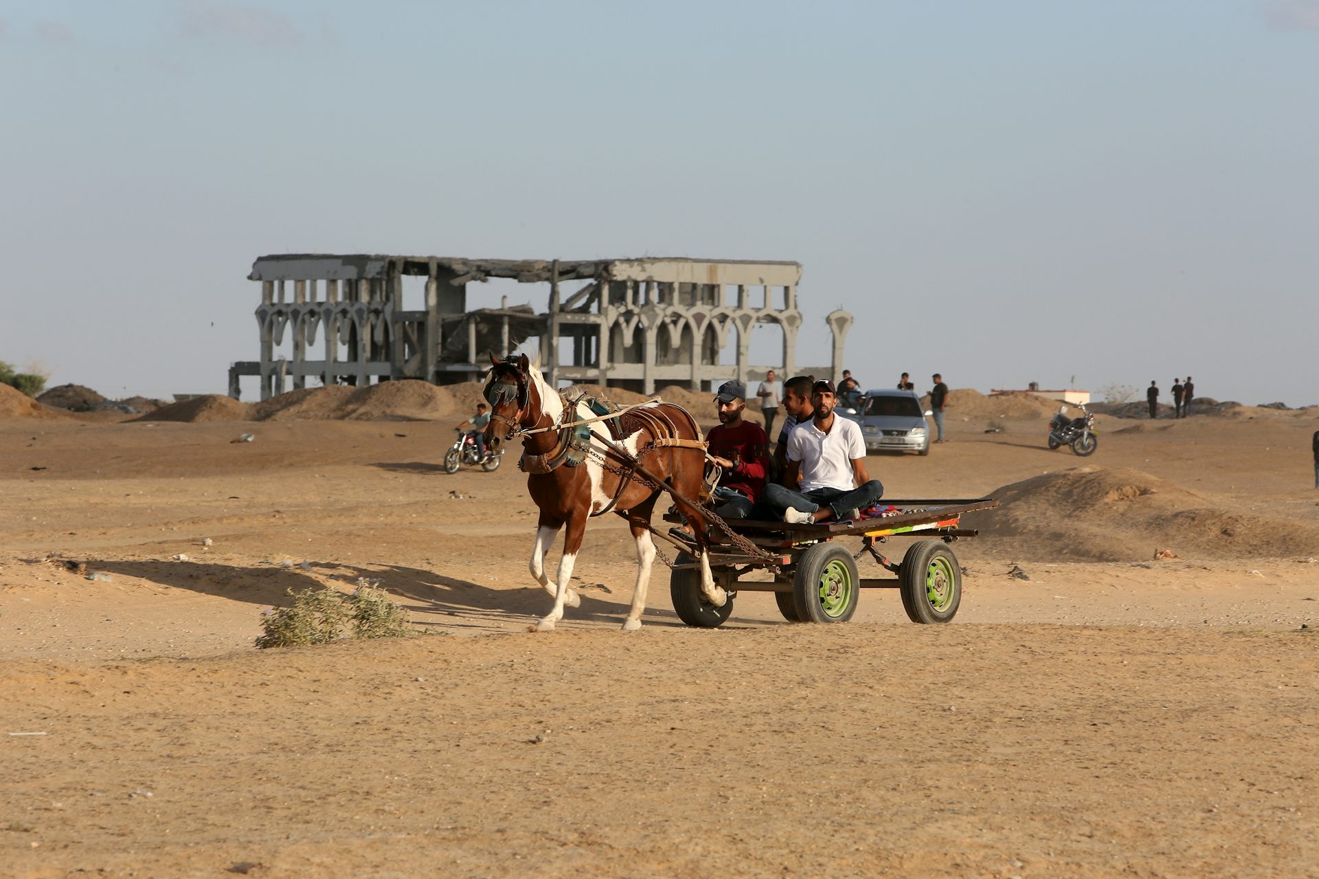 Palestinians near the ruins of Gaza's international airport.