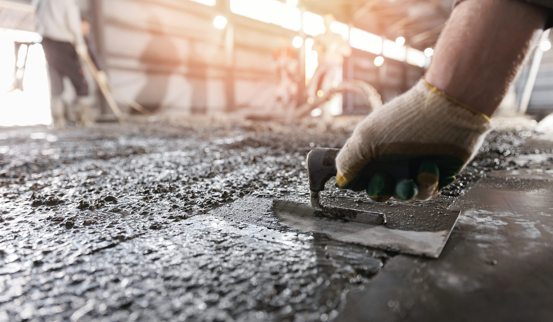 Screed being levelled on a construction site.