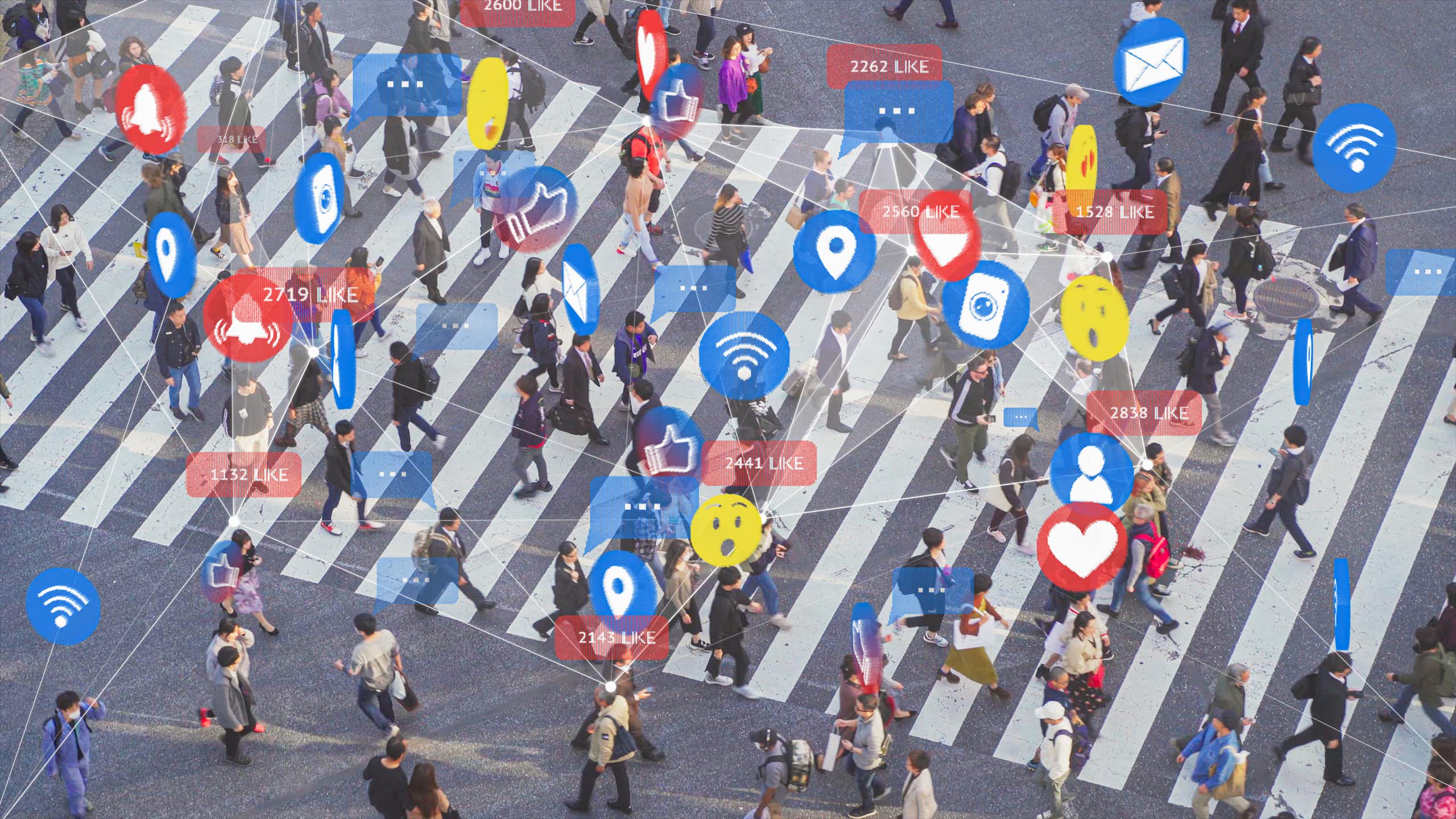photo of pedestrians walking on an oversize crosswalk with the people overlaid by smartphone icons
