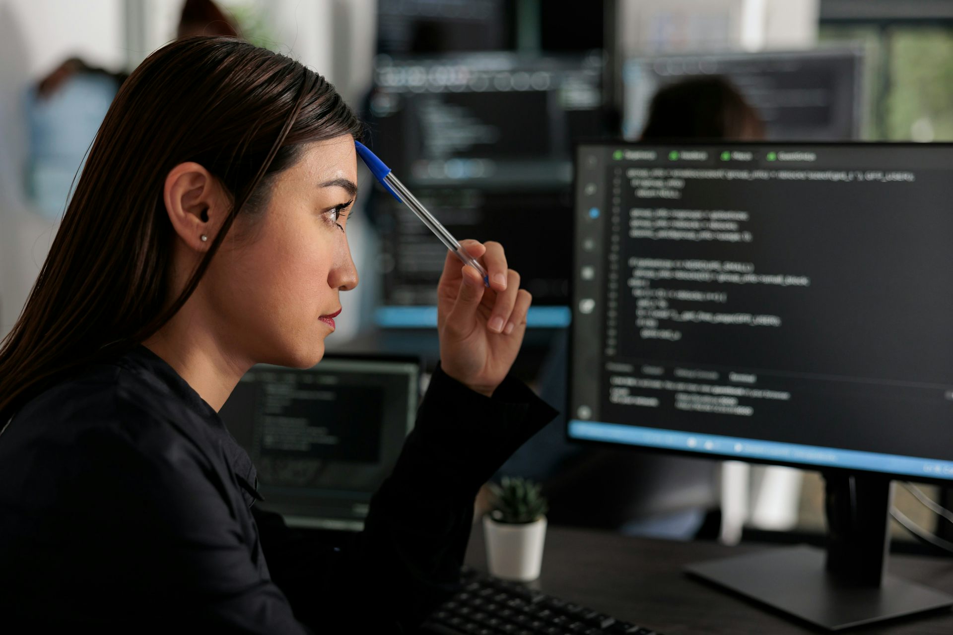 A woman works at a computer