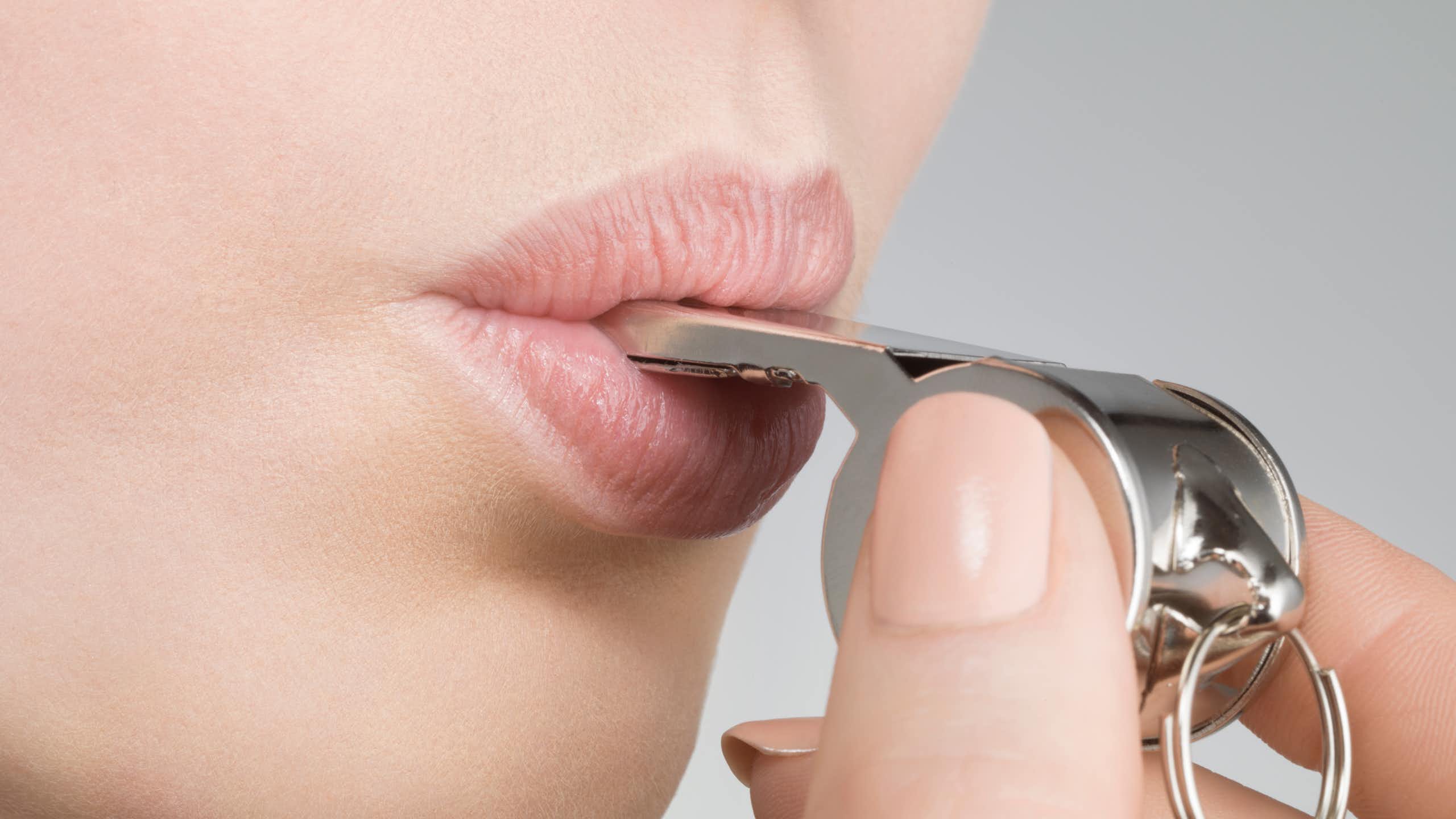 A close-up photo shows a woman blowing a whistle.