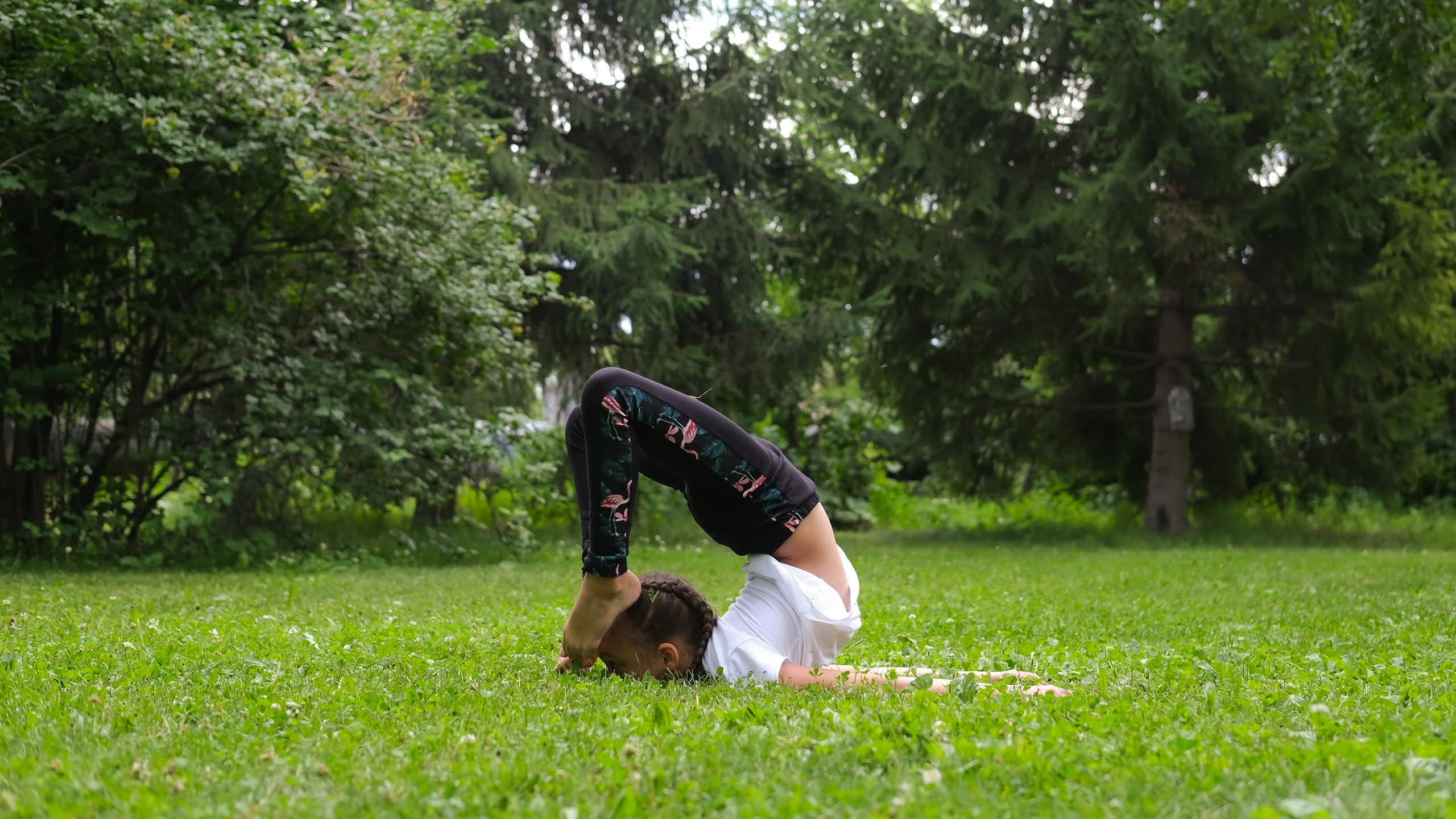 Girl does exercises to strengthen her body and spirit.