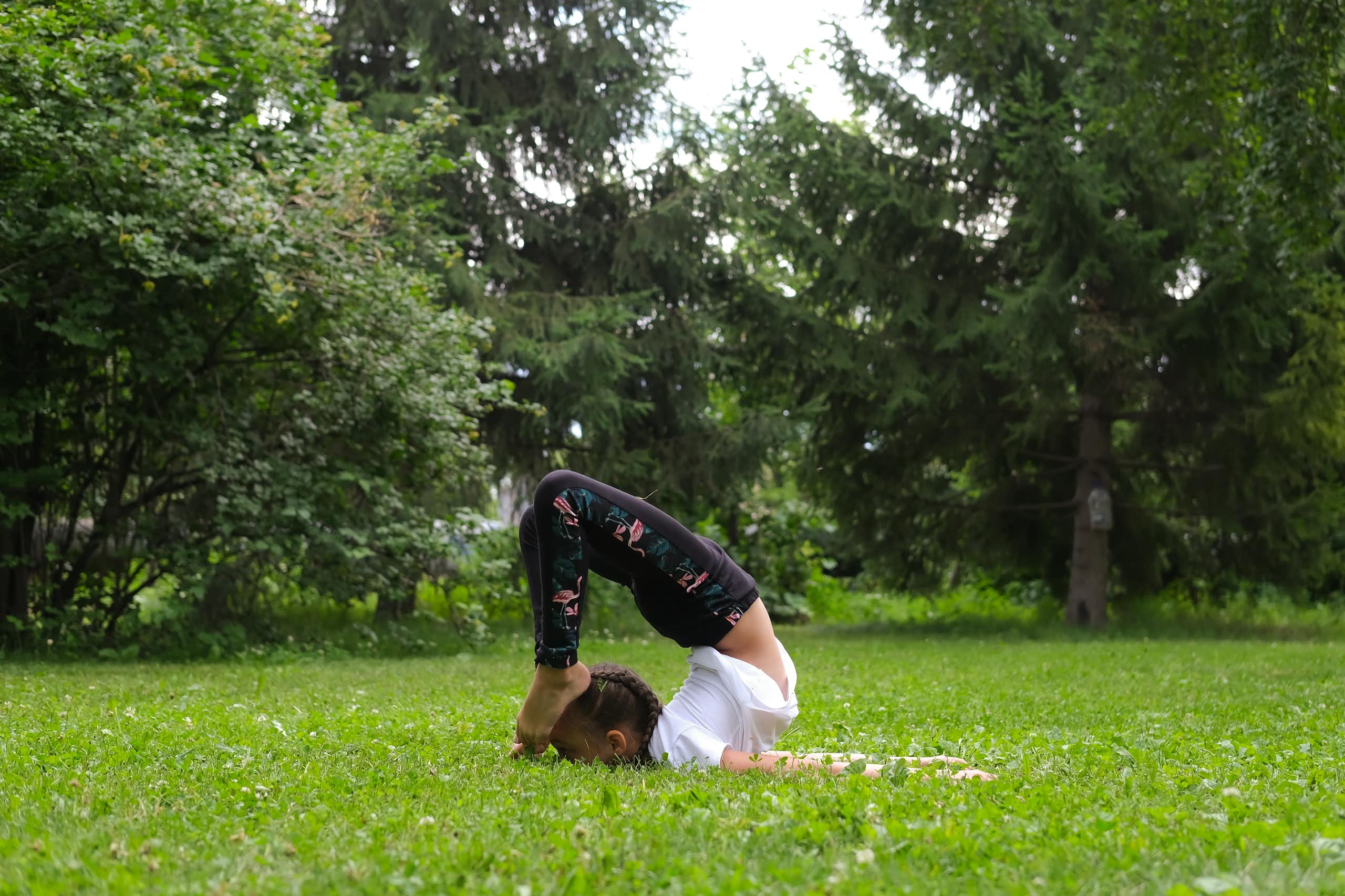 Girl does exercises to strengthen her body and spirit.