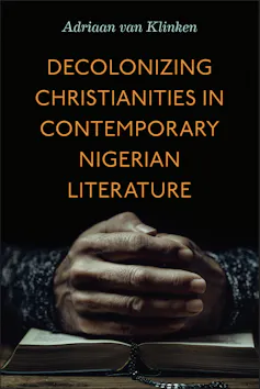 A book cover with a photo of African hands clasped in prayer on a book.