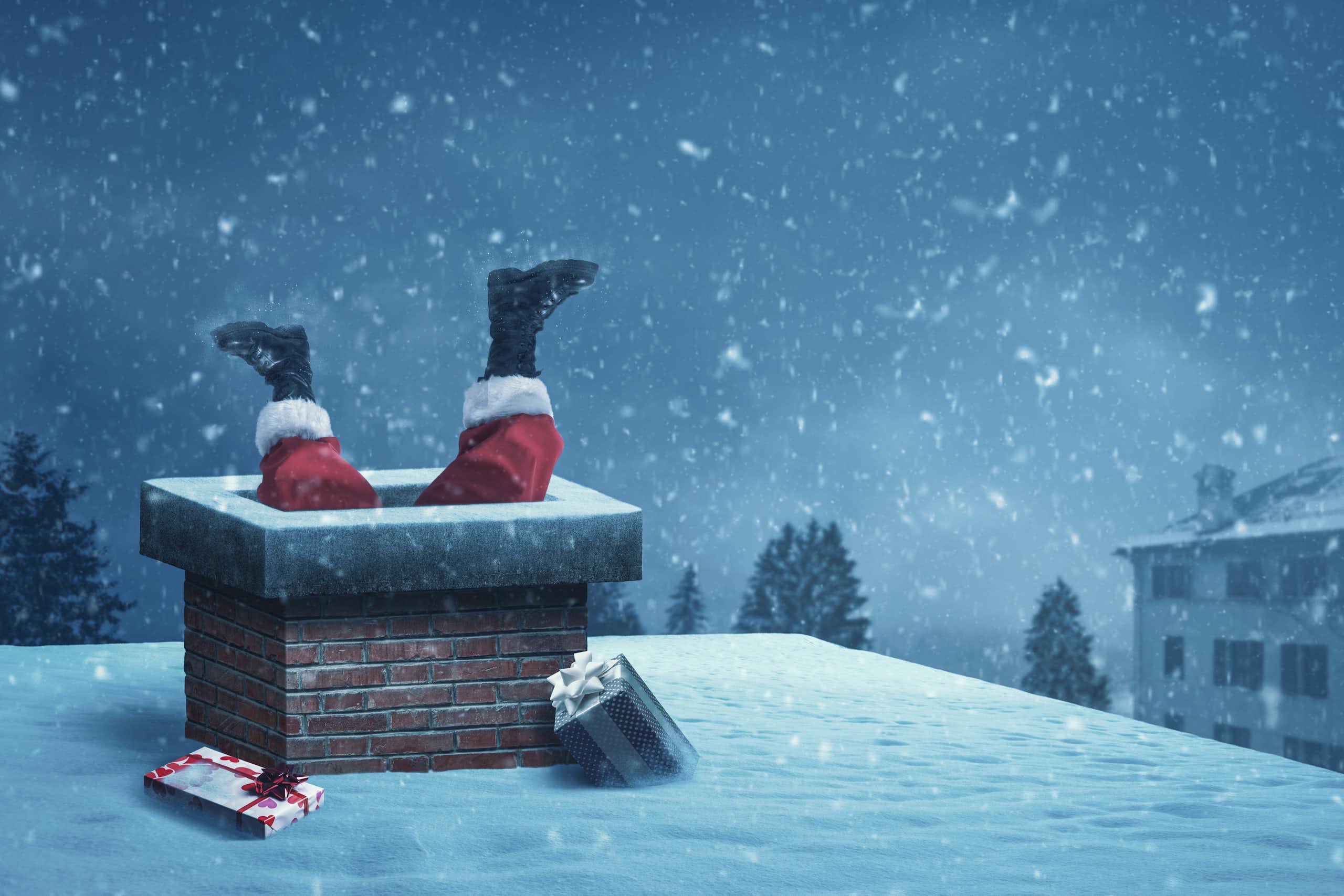 Santa's legs sticking out of a chimney