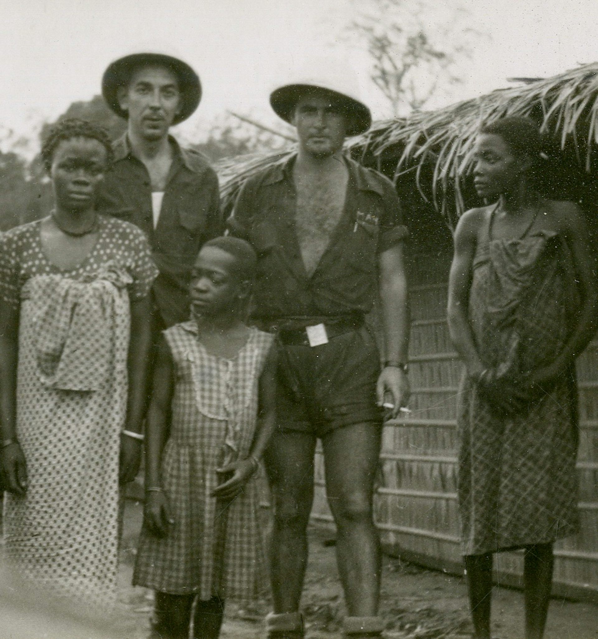 Guinean settlers with wives and girlfriend.