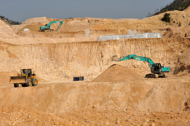 excavators at open cut mine.
