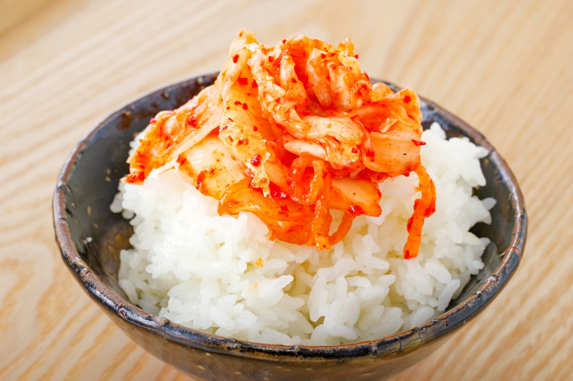 Kimchi piled on top of a bowl of rice.