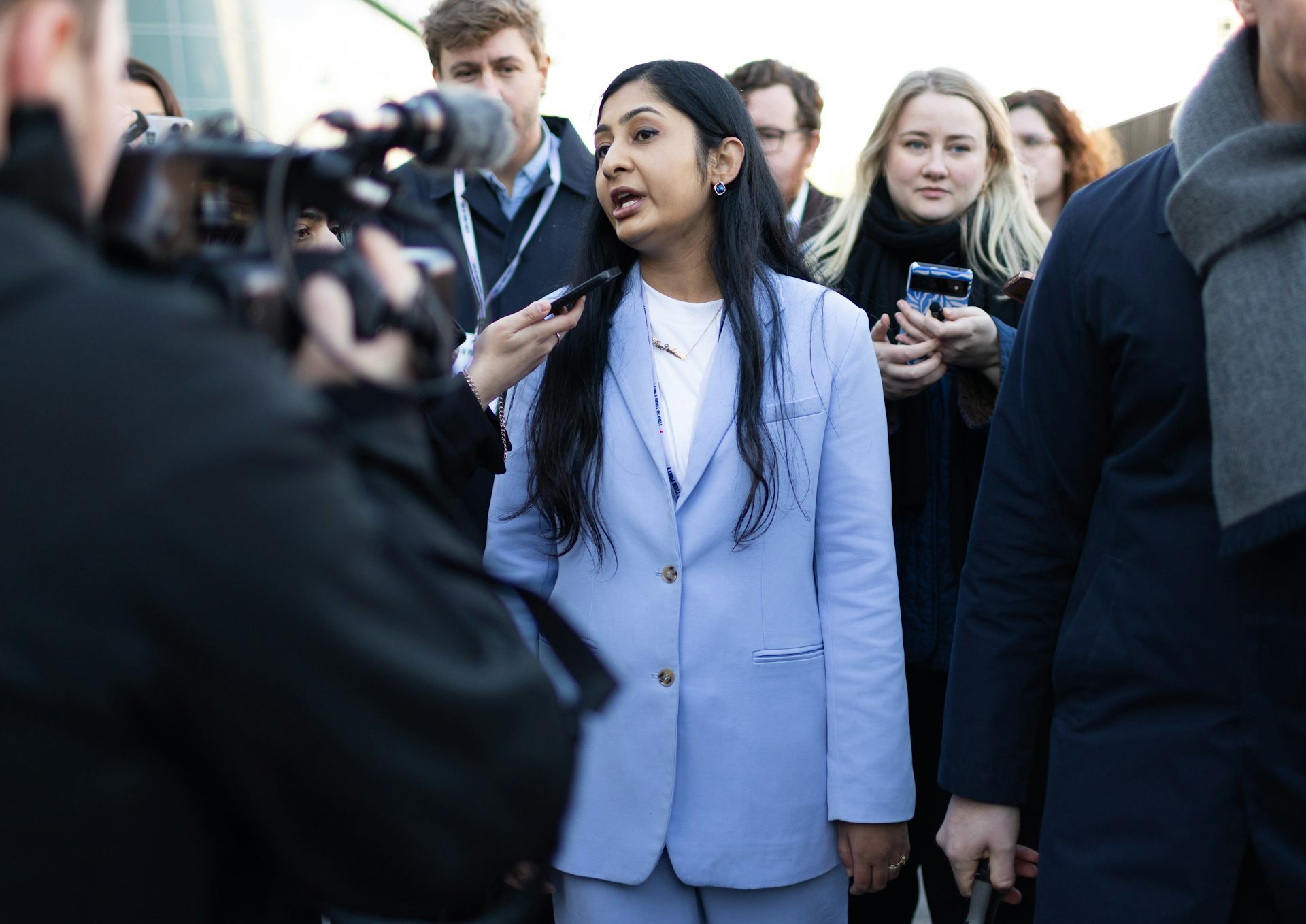 Zarah Sultana talking to the press.