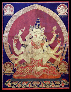 An old painting of a many-armed religious figure.