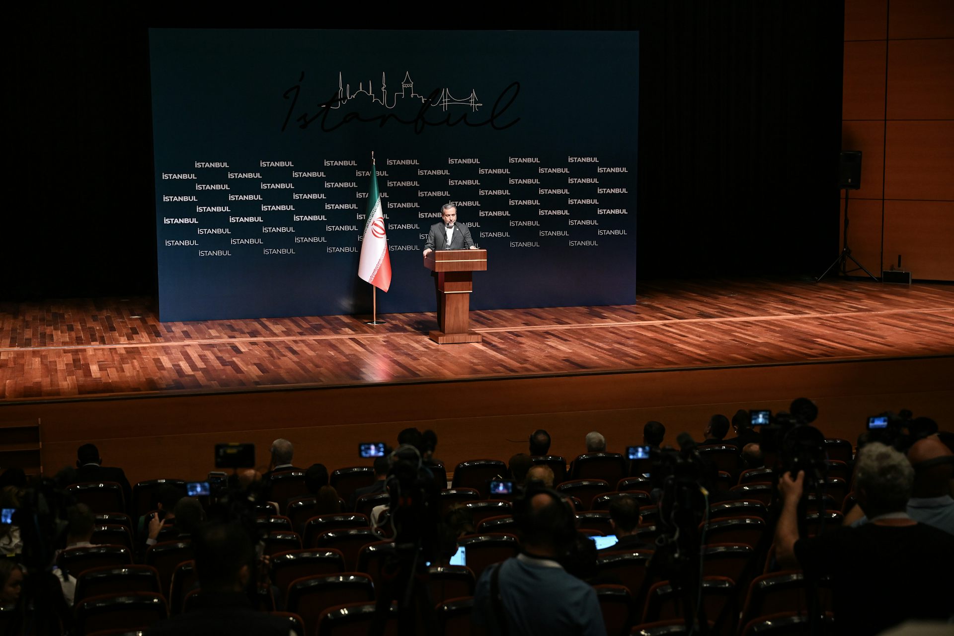 A man gives a speech at a conference.