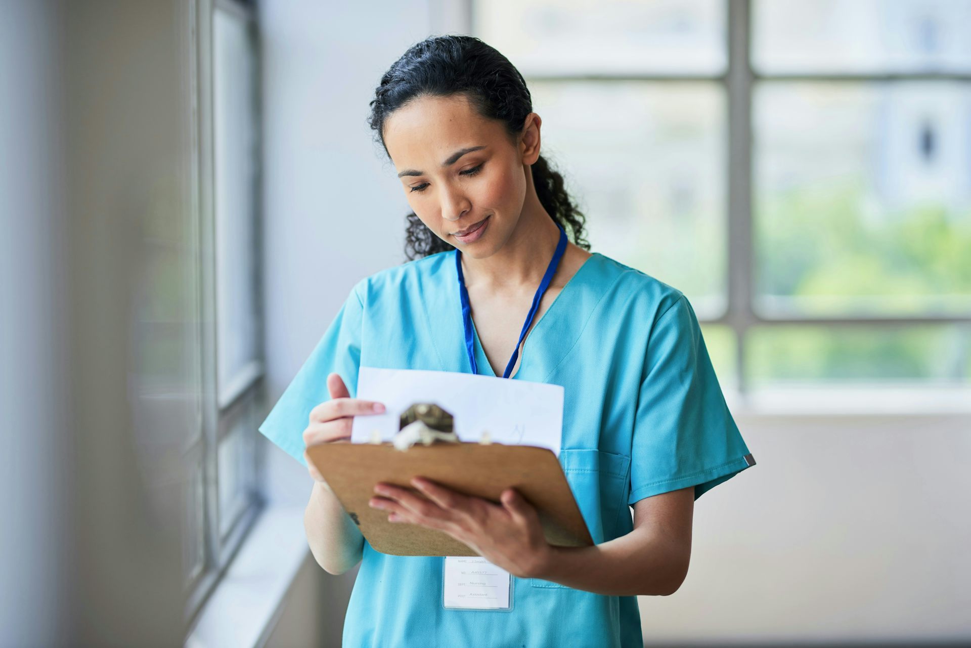 A health worker reviewing notes.