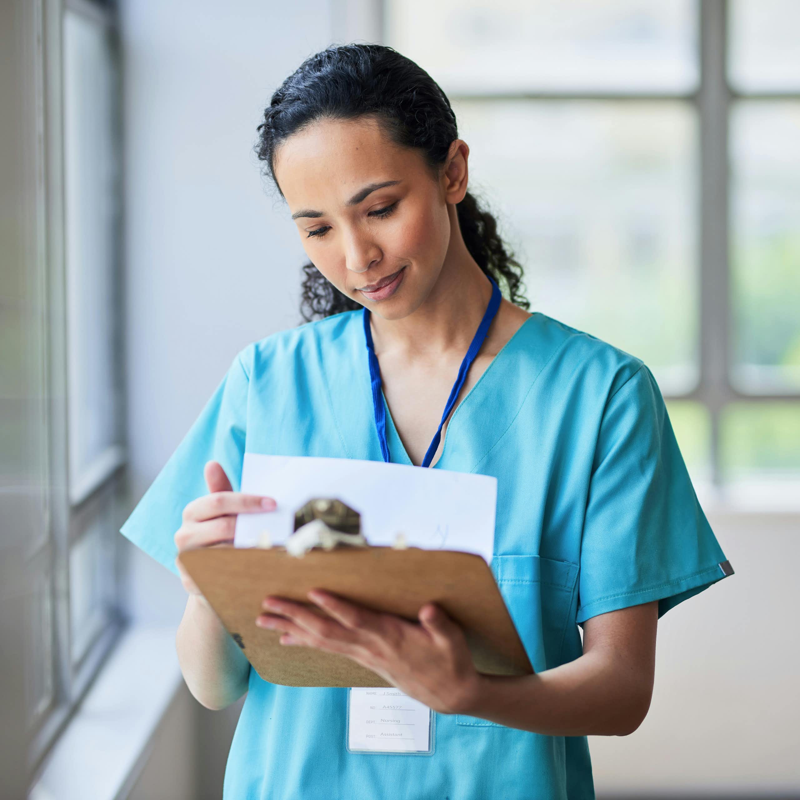 A health worker reviewing notes.