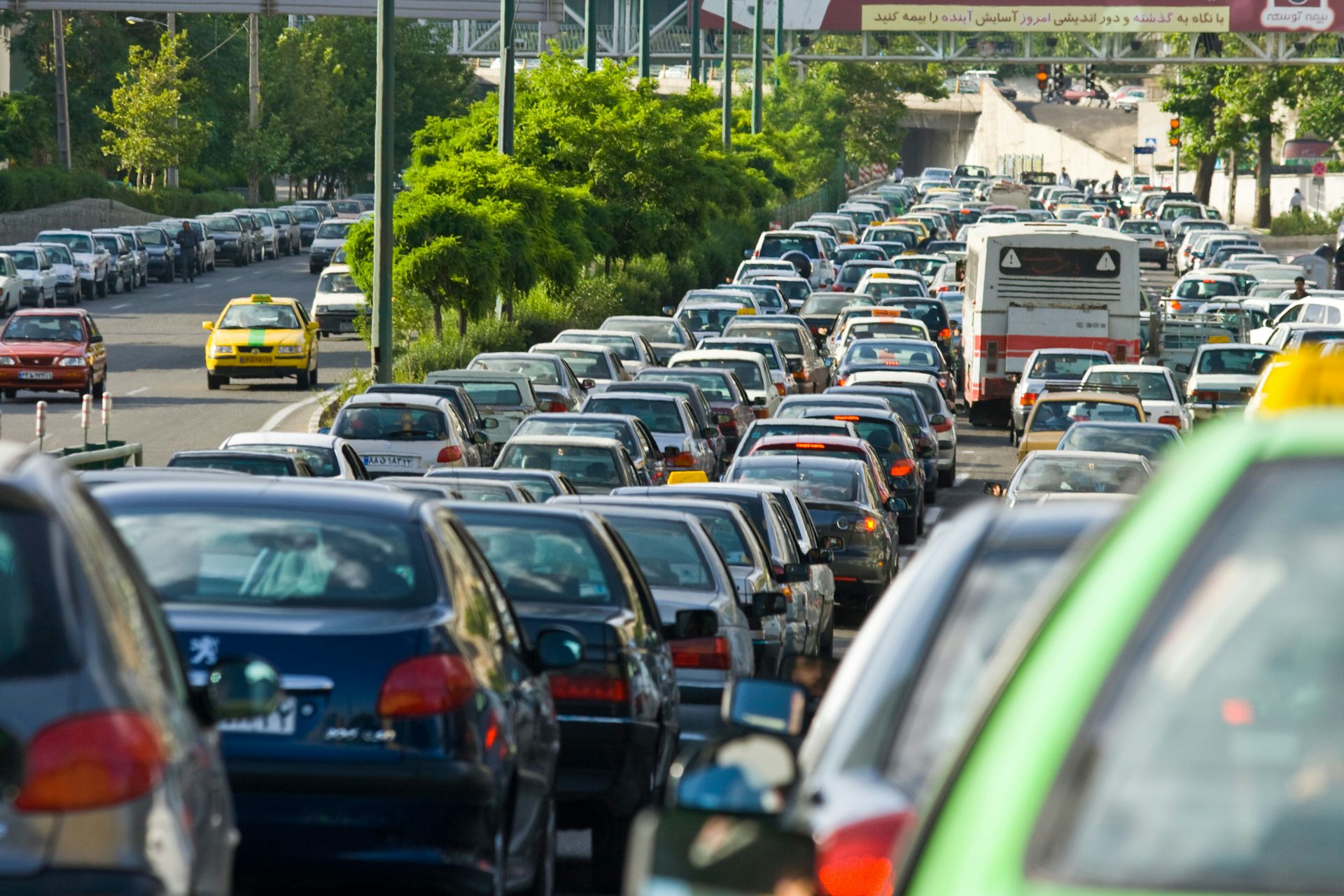 Cars on a busy road in Tehran.