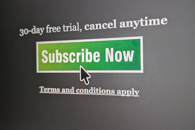 A cursor hovering over a subscribe now button on a website