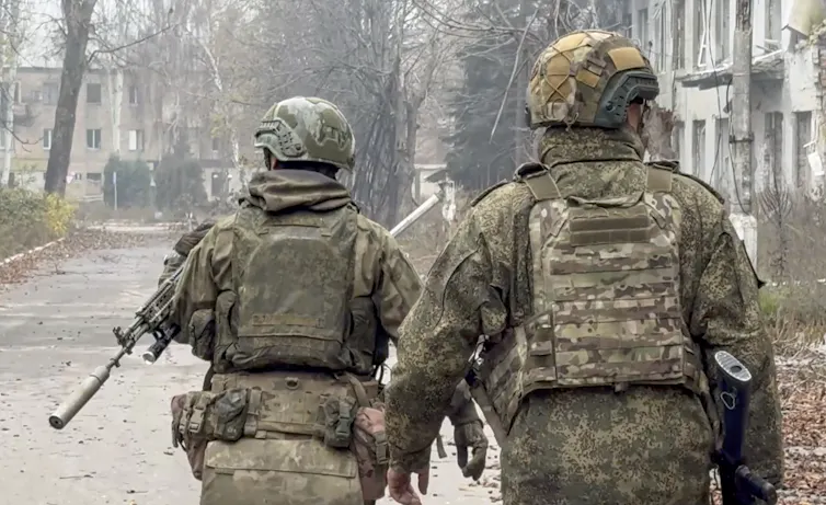 Russian servicemen on the streets of Pokrovsk.