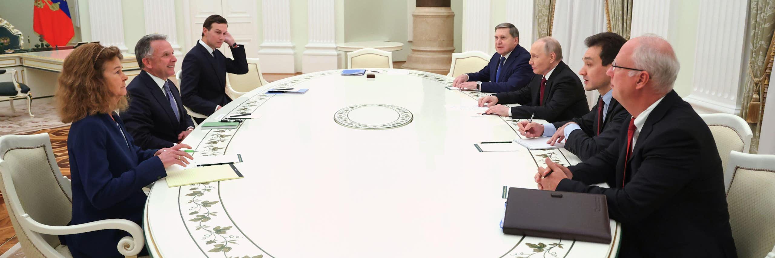 Russian president Vladimir Putin sits at his long table with US negotiators Steve Witkoff and Jared Kushner.