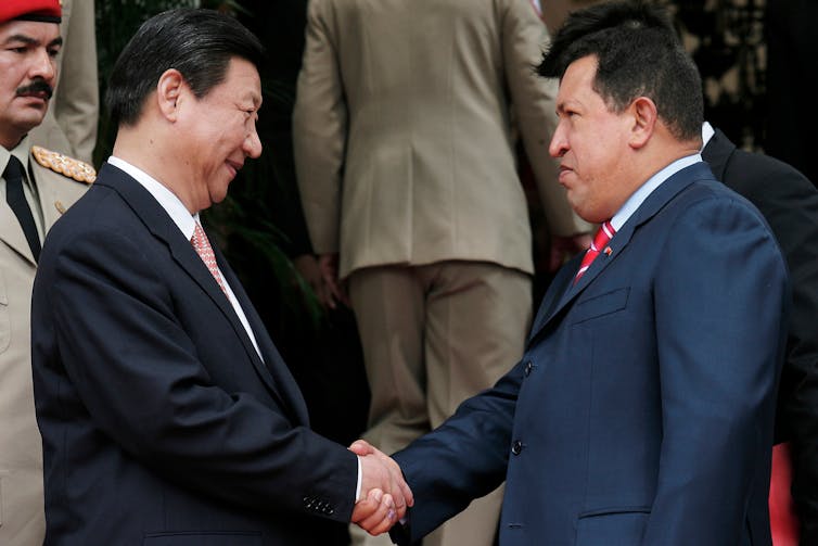 Why China is staring at Trump’s Venezuela marketing campaign carefully 1 Xi Jinping shaking hands with Hugo Chávez.