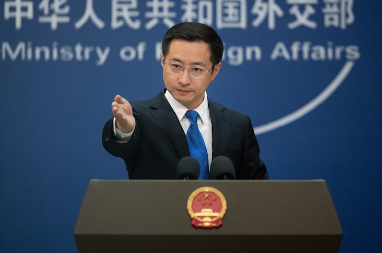 Lin Jian speaks at a press conference in Beijing.
