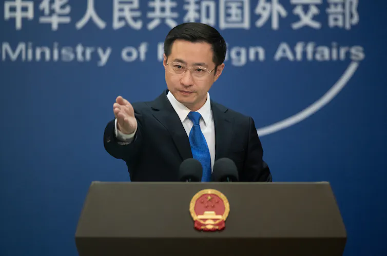 Lin Jian speaks at a press conference in Beijing.