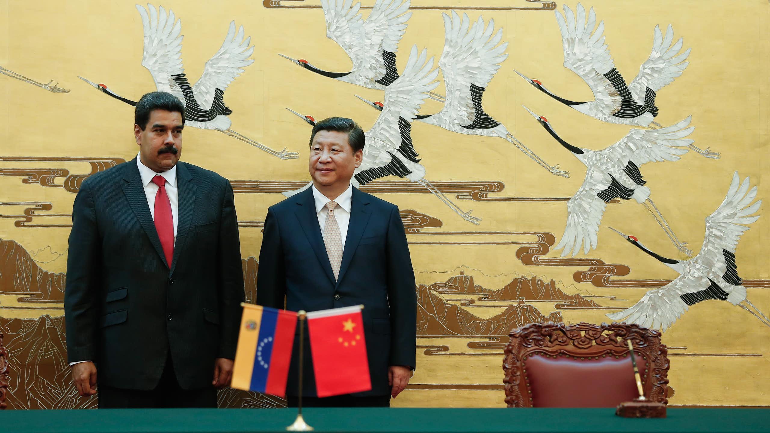 Xi Jinping and Nicolás Maduro standing next to each other.