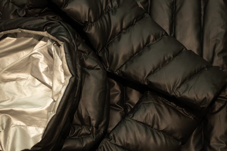 New fabrics, outdated physics – the science in the back of how your wintry weather jacket helps to keep you heat 1 A close up of a down puffer jacket.