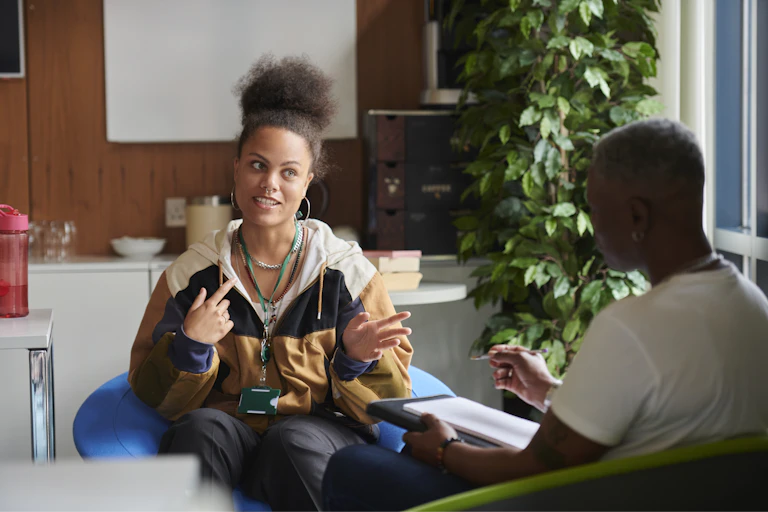 Young woman talks to her support worker