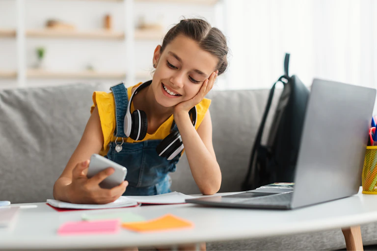 Young girl looking at her phone.