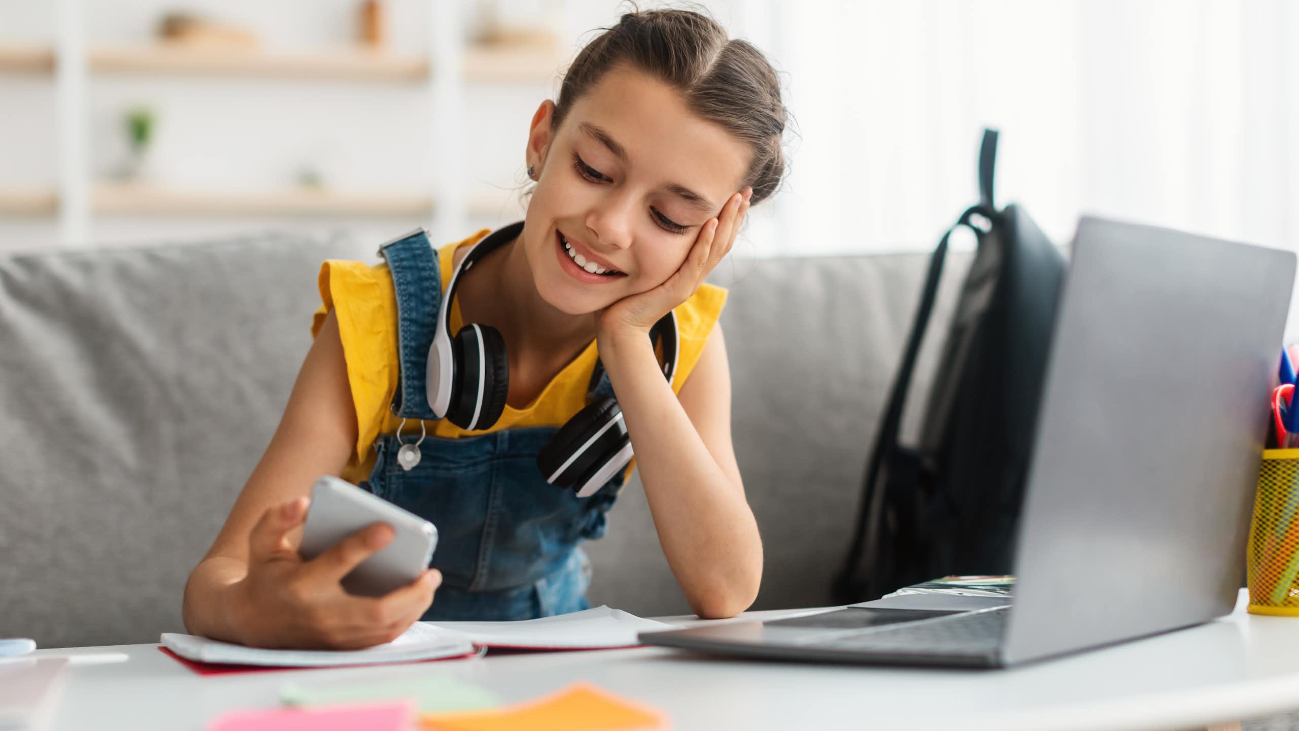 Young girl looking at her phone.