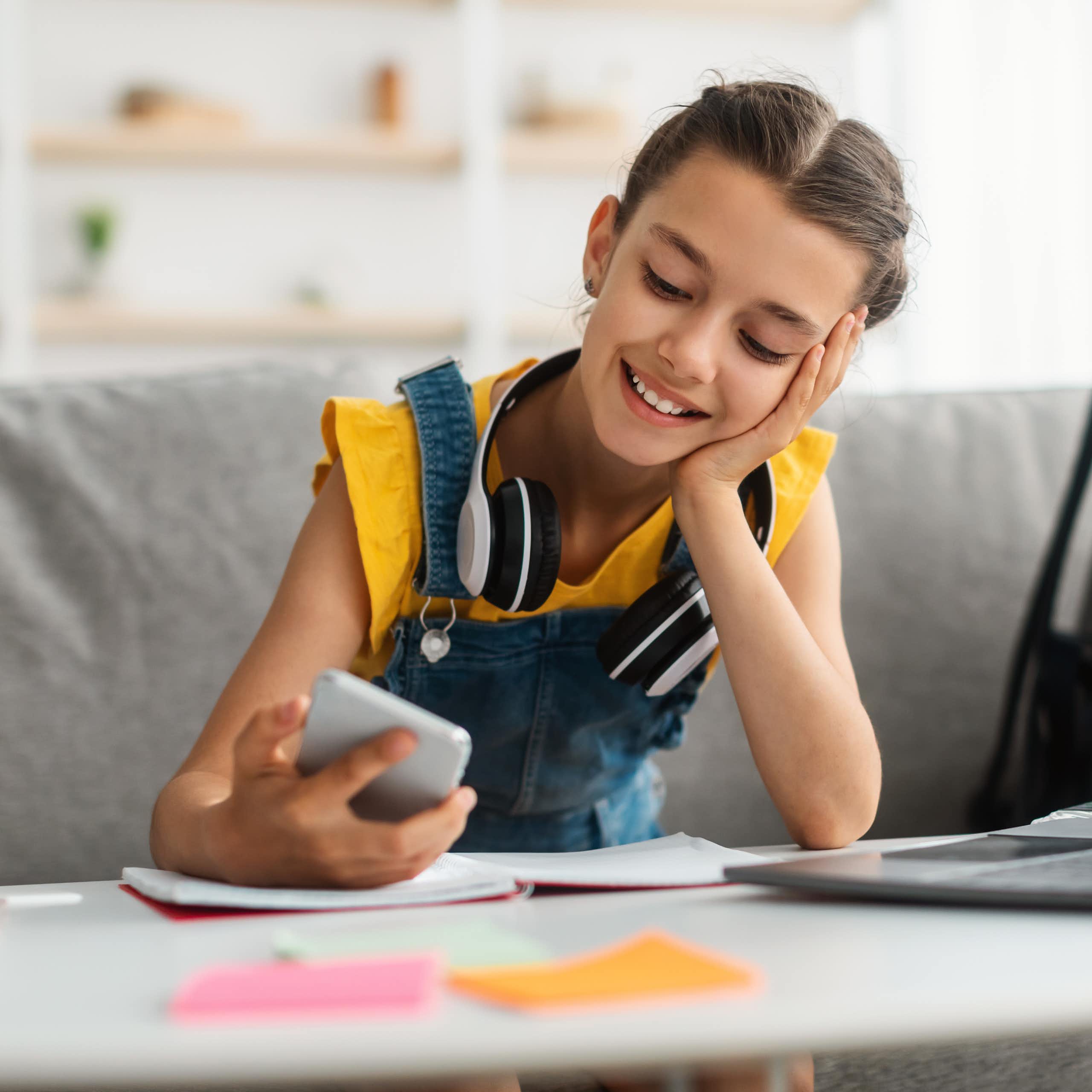 Young girl looking at her phone.