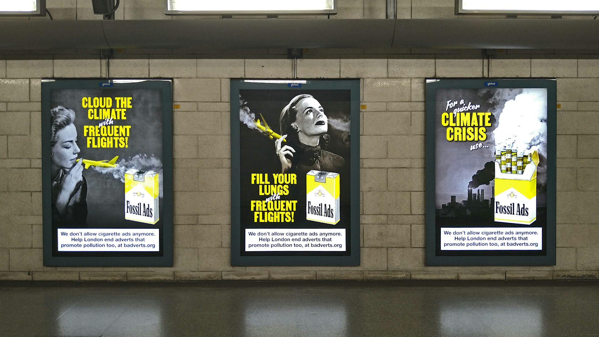 three fossil ads posters on tube station wall